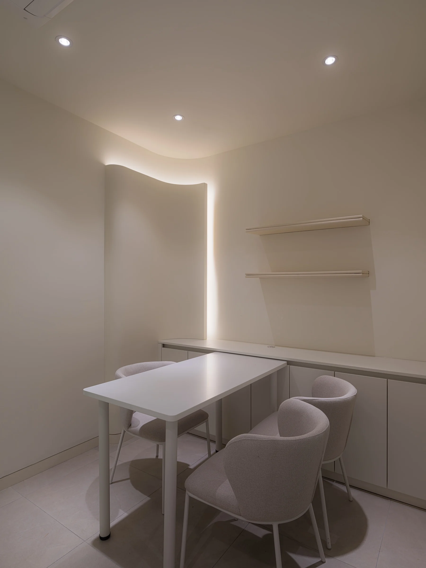 A counselling room with a table and chairs, where staff go through your questions before the doctor